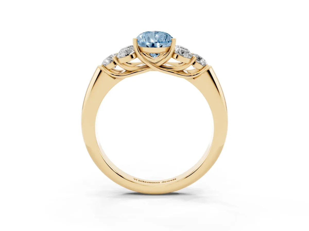 Fancy Blue Pear Cut Cut Diamond Cluster Ring with Round Accent Stones and Prong Setting on a Classic Band Yellow gold