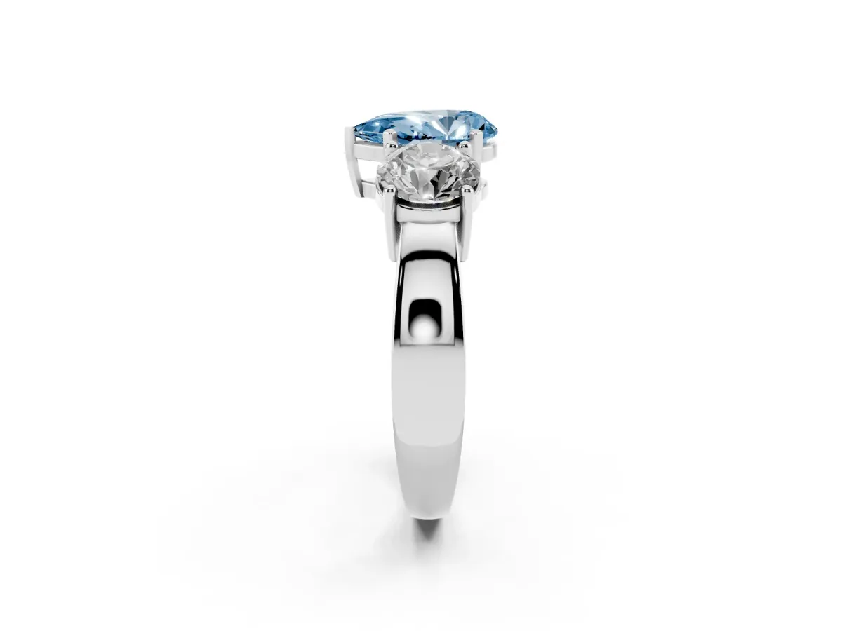 Fancy Blue Three-Stone Pear Cut Diamond Ring with Round Side Stones, Classic Band, and Four-Prong Setting White gold