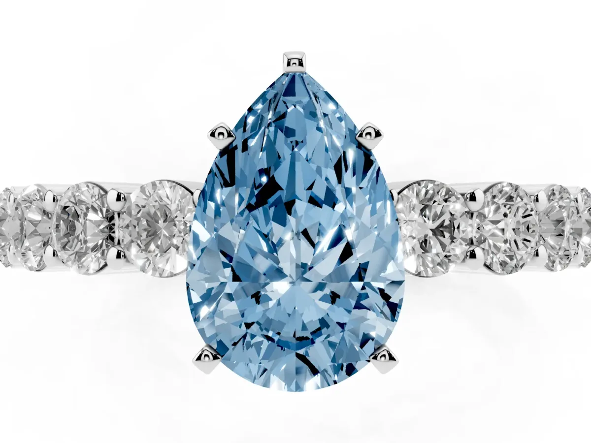 Fancy Blue Pear Cut Diamond Solitaire Ring with Shared Prong Round Side Stones Platinum
