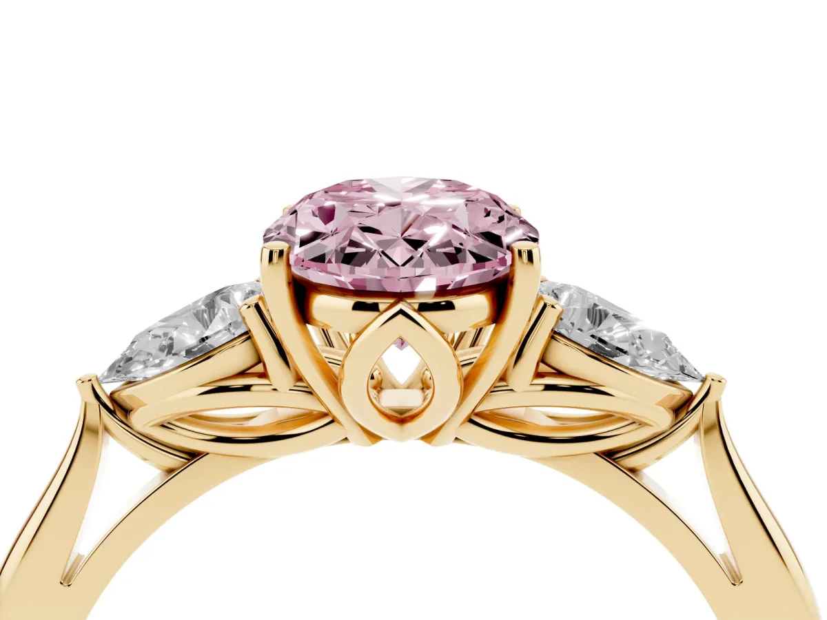 Fancy Pink Three-Stone Oval Cut Diamond Ring with Pear Side Stones in Four-Prong Setting Yellow gold