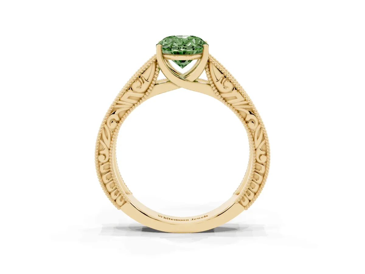 Fancy Green Oval Cut Diamond Solitaire Ring with Engraved Band and Four-Prong Setting Yellow gold