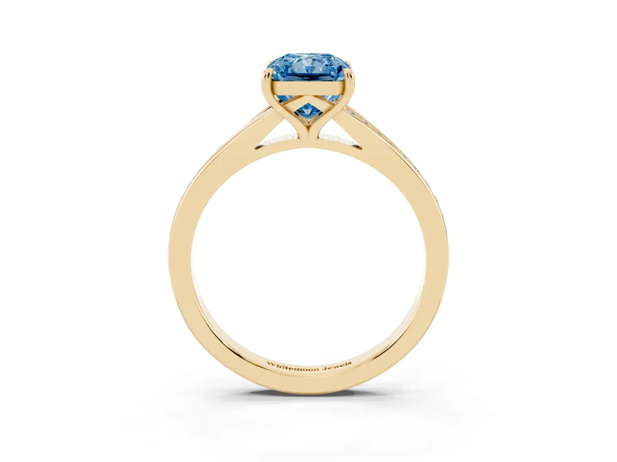 Fancy Blue Radiant Cut Diamond Solitaire Ring with Pavé Band and Prong Setting Yellow gold