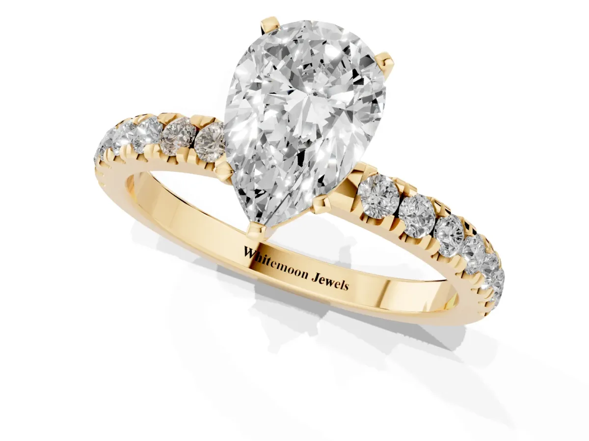 Pear Cut Diamond Solitaire Ring with Pavé Accents and Four-Prong Setting Yellow gold