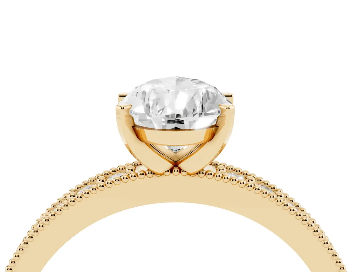 Pear Cut Diamond Milgrain Pavé Engagement Ring with Four-Prong Setting Yellow gold