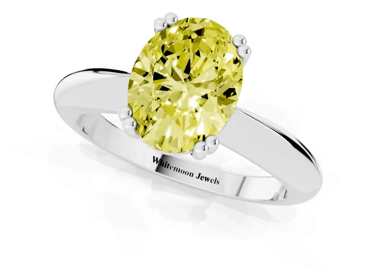 Fancy Yellow Oval Cut Cut Solitaire Engagement Ring with Tapered Band and Four-Prong Setting Silver