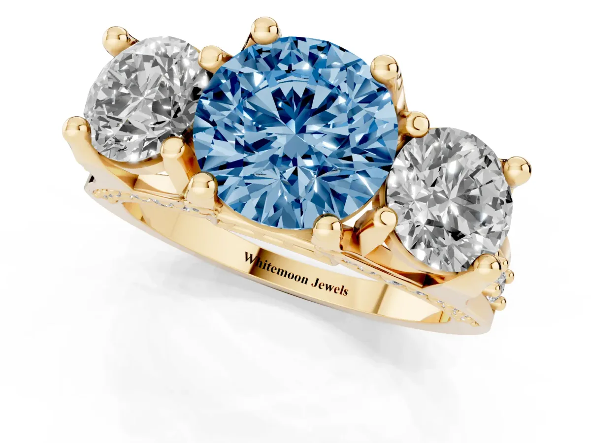 Fancy Blue Round Cut Diamond Three-Stone Ring with Channel Set Band and Four-Prong Setting Yellow gold