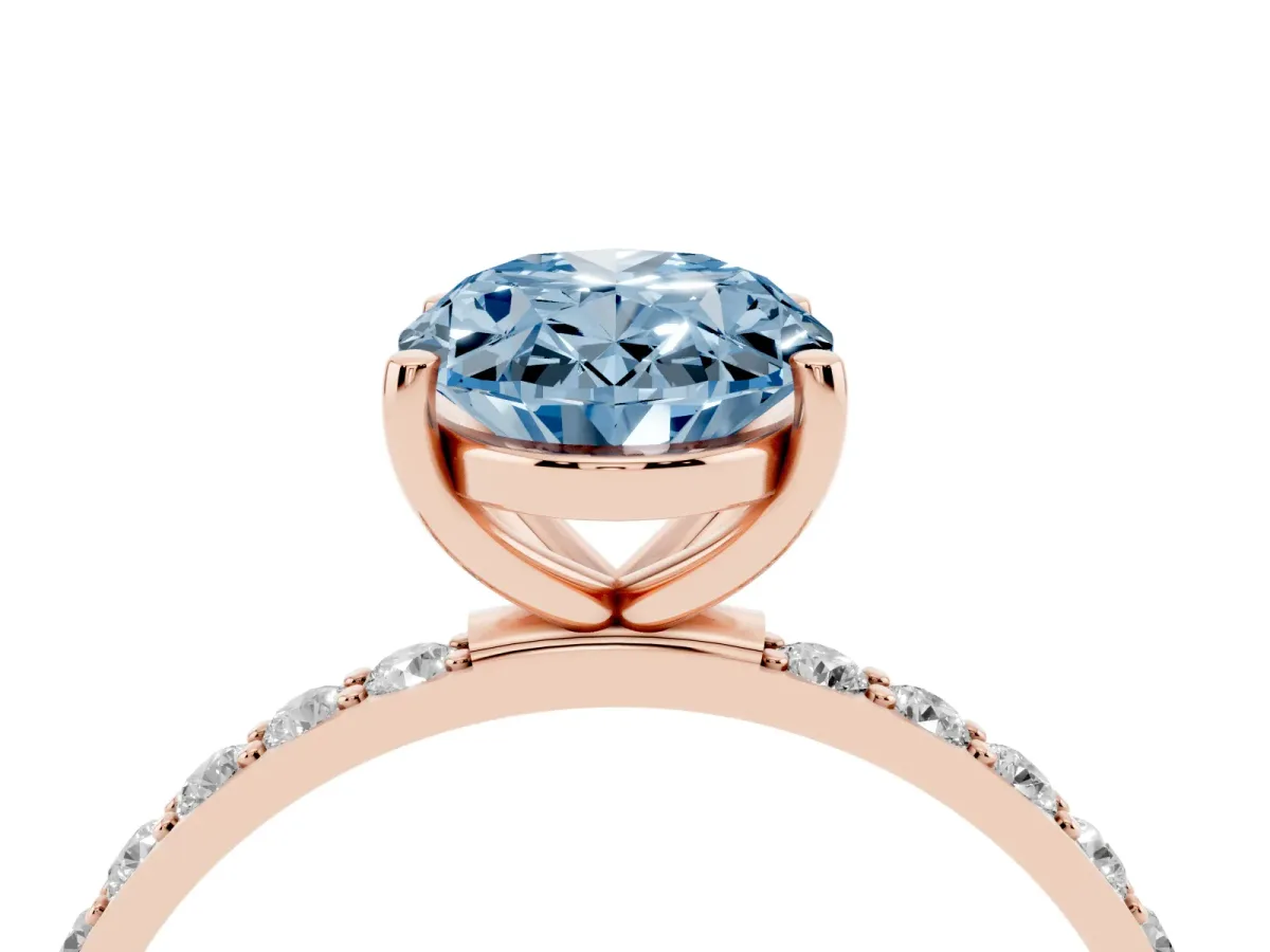 Fancy Blue Oval Cut Diamond Solitaire Ring with Round Pavé Shoulders and Prong Setting Rose gold
