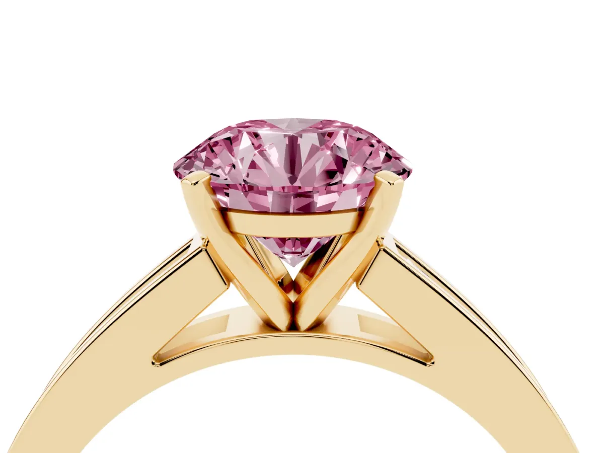 Fancy Pink Round Cut Solitaire Diamond Ring with Channel-Set Band and Four-Prong Setting Yellow gold