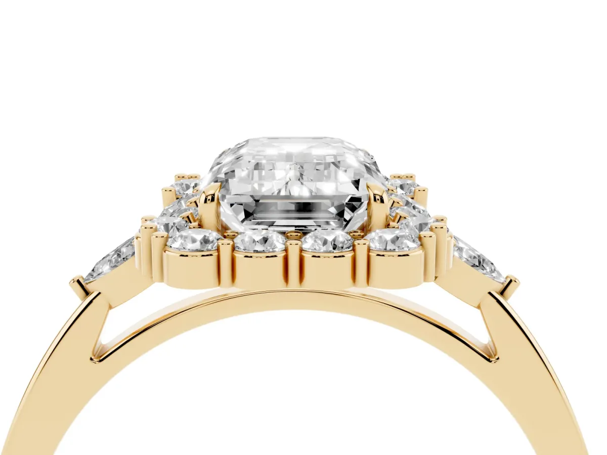 Emerald Cut Diamond Halo Ring with Pear Side Stones and Prong Setting Yellow gold