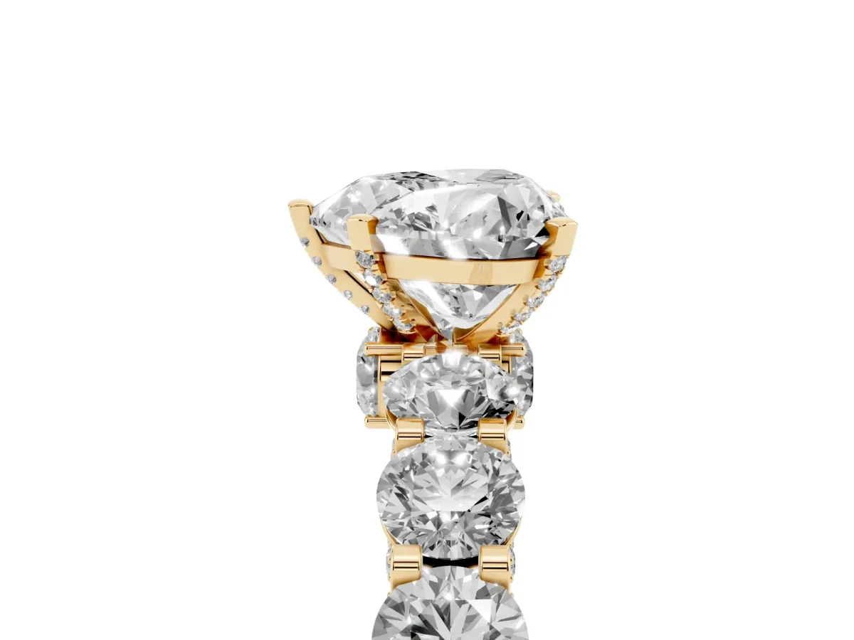 Heart Cut Diamond Side Stone Engagement Ring with Four-Prong Setting Yellow gold