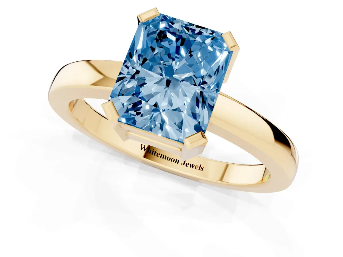 Fancy Blue Radiant Cut Cut Solitaire Ring with Four-Prong Setting and Classic Band Yellow gold