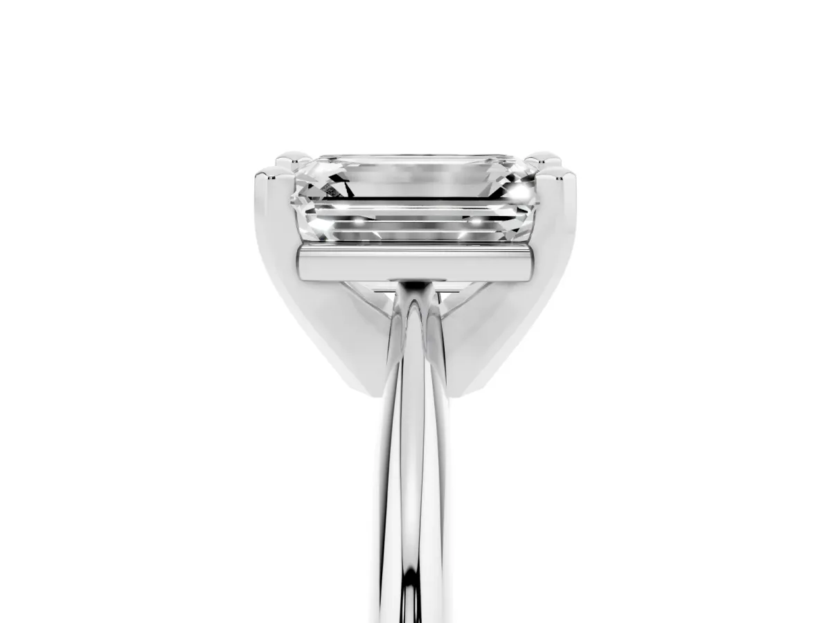 Emerald Cut Cut Solitaire Ring with Four-Prong Setting on a Classic Band Silver