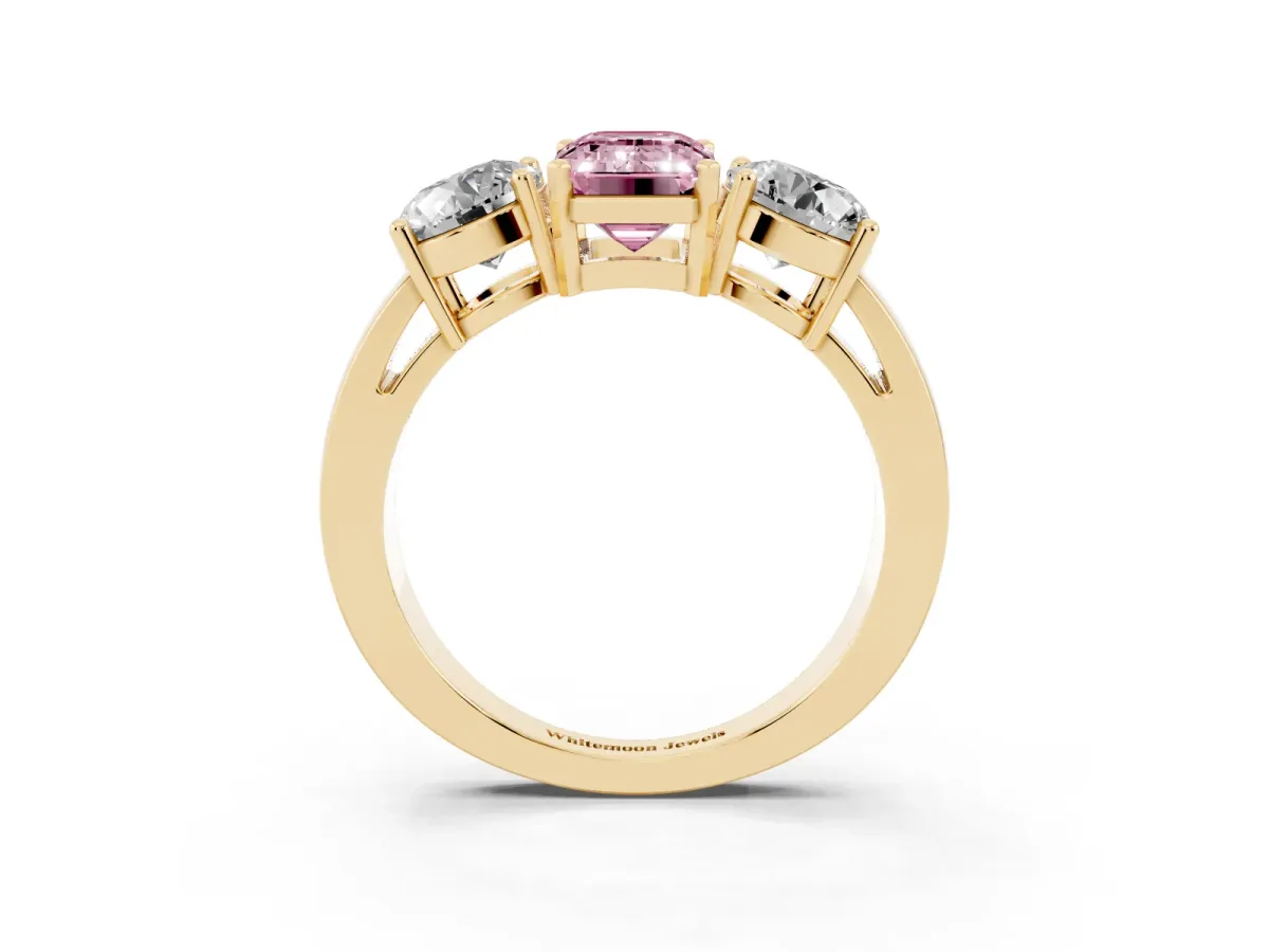 Fancy Pink Three-Stone Emerald Cut Diamond Ring with Round Side Stones, Classic Band, and Four-Prong Setting Yellow gold