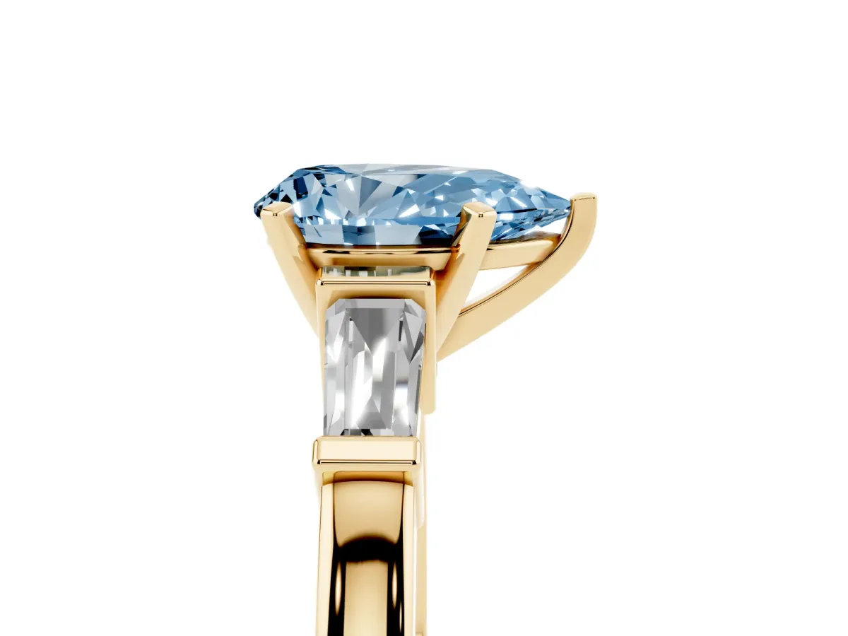 Fancy Blue Pear Cut Cut Diamond Solitaire Ring with Tapered Baguette Accents and Four-Prong Setting Yellow gold