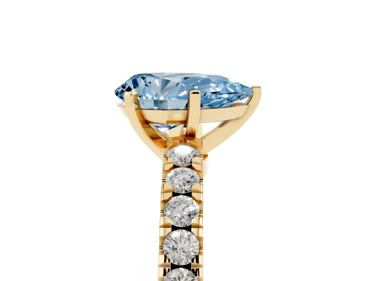 Fancy Blue Pear Cut Solitaire Diamond with Pavé Band and Four-Prong Setting Yellow gold