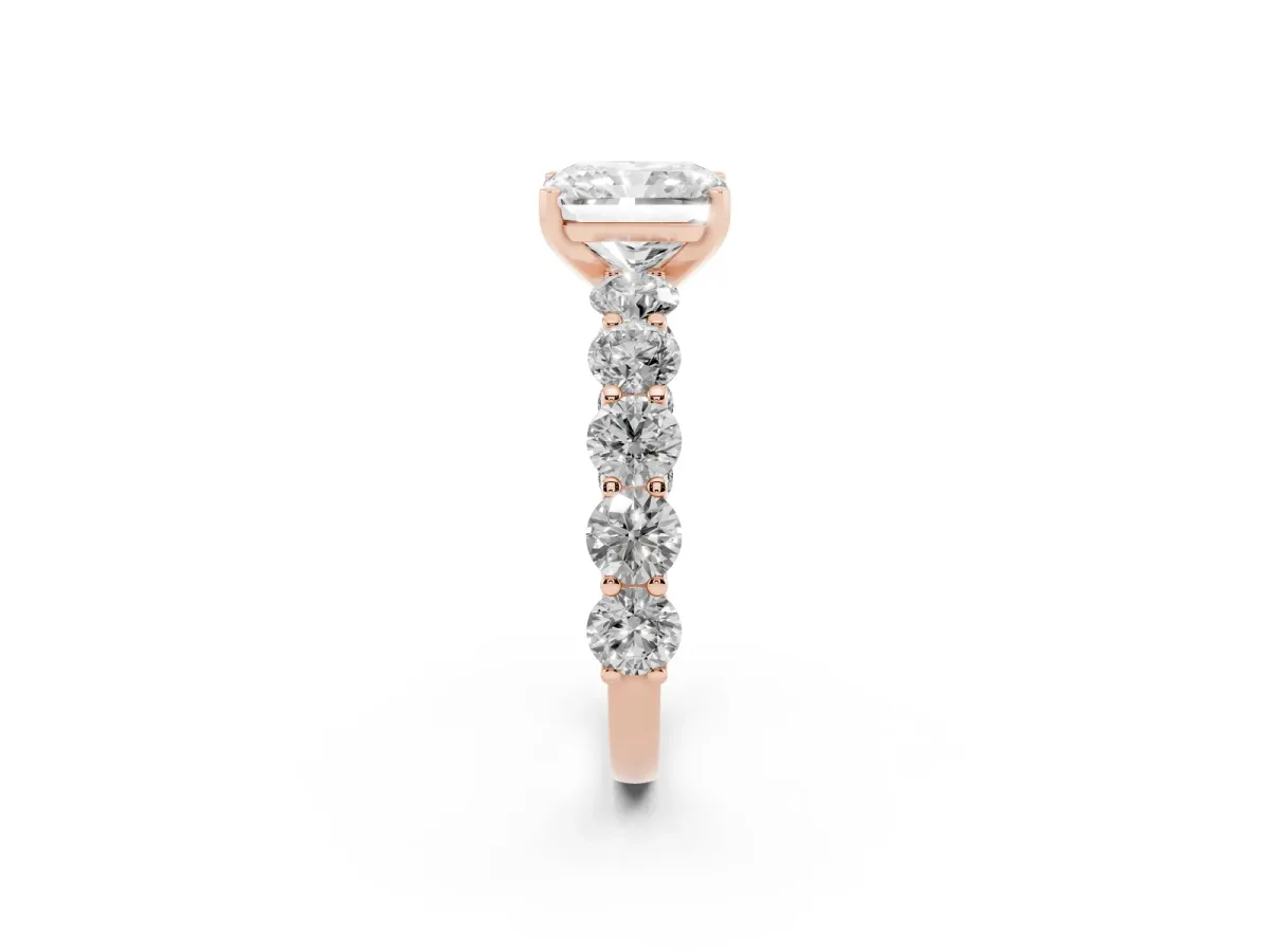 Radiant Cut Diamond Prong Setting with Side Stones on a Pave Band Rose gold