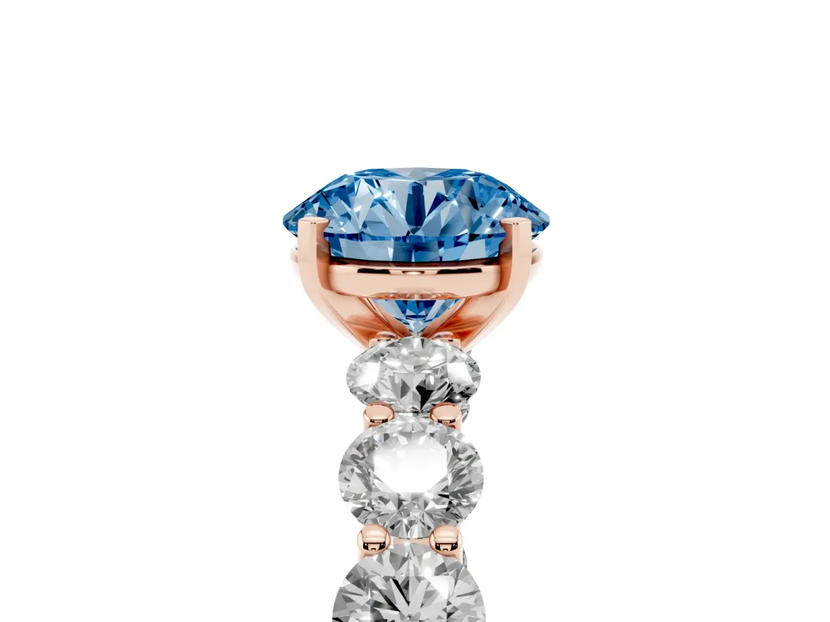 Fancy Blue Round Cut Diamond Prong Setting with Side Stones on a Pave Band Rose gold