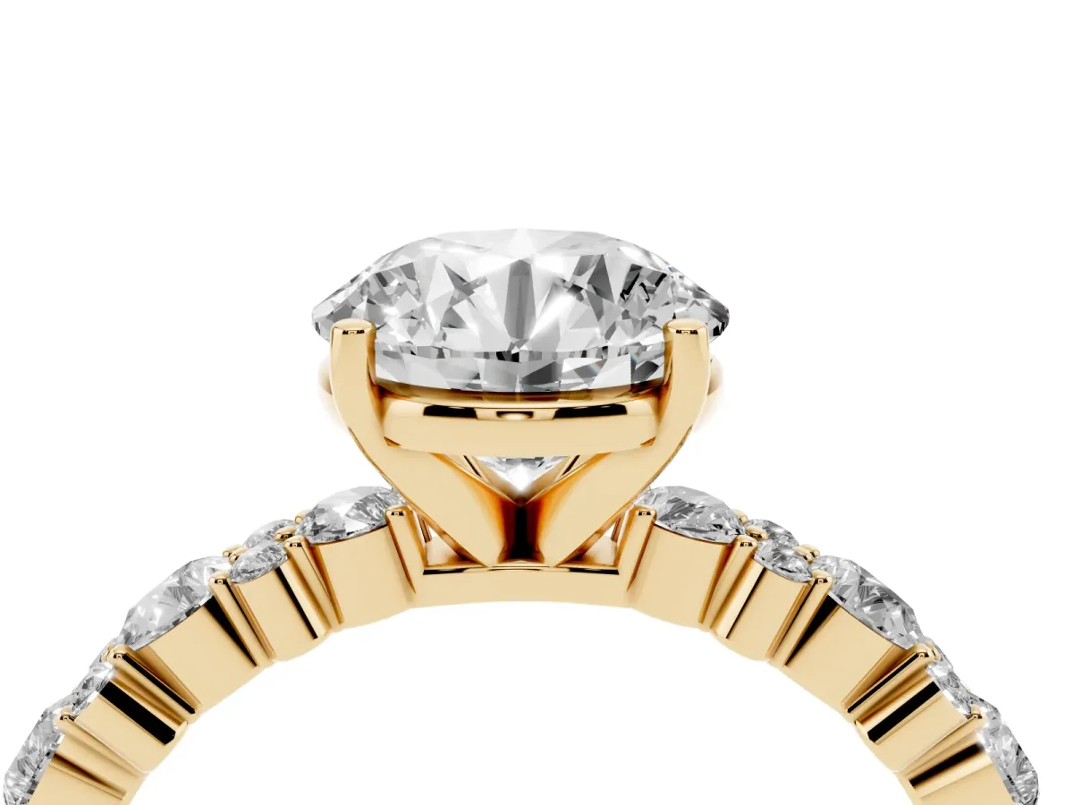 Round Cut Diamond Side Stone Solitaire Ring with Round and Four-Prong Setting Yellow gold