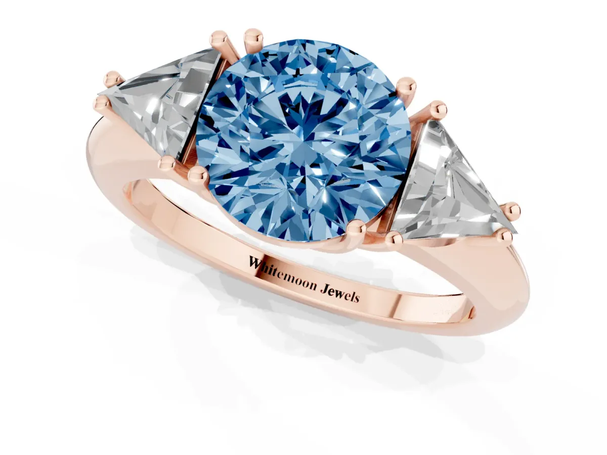 Fancy Blue Three-Stone Round Cut Diamond Engagement Ring with Trillion Side Stones and Prong Setting Rose gold