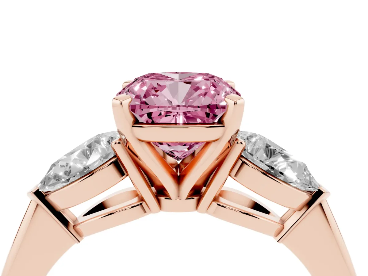 Fancy Pink Three-Stone Cushion Cut Diamond Ring with Pear Side Stones and Four-Prong Setting Rose gold