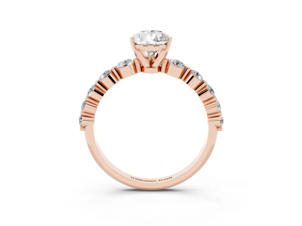 Pear Cut Solitaire Diamond Ring with Pave Band and Four-Prong Setting Rose gold