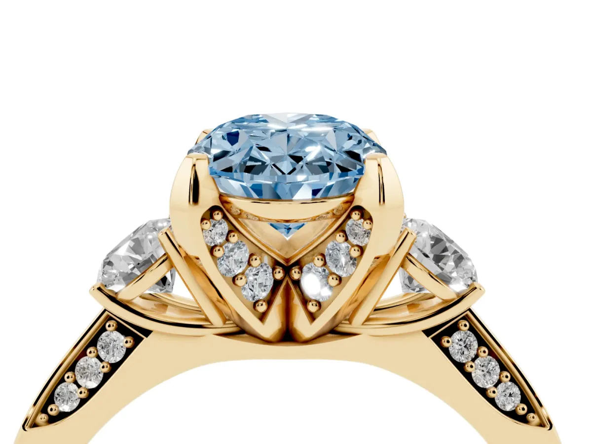 Fancy Blue Oval Cut Brilliant Three-Stone Diamond Ring with Pavé Band and Four-Prong Setting Yellow gold