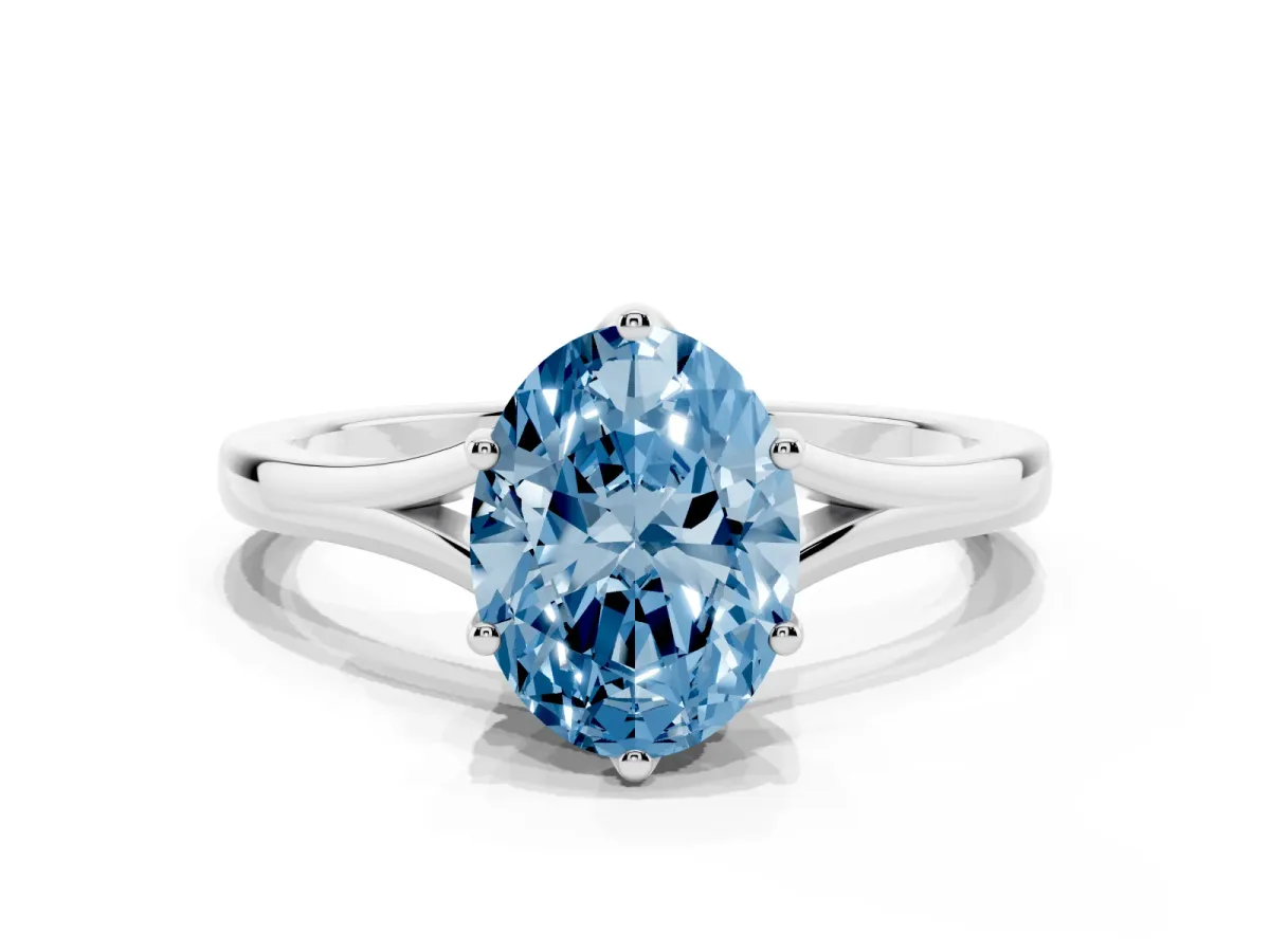 Fancy Blue Oval Cut Solitaire Diamond Ring with Six-Prong Setting and Tapered Band Silver
