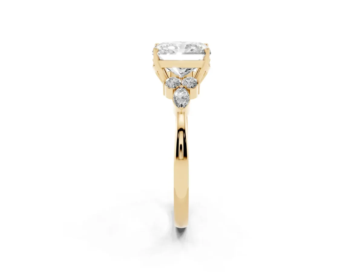 Radiant Cut Brilliant Diamond Solitaire Ring with Pear Side Stones and Four-Prong Setting Yellow gold