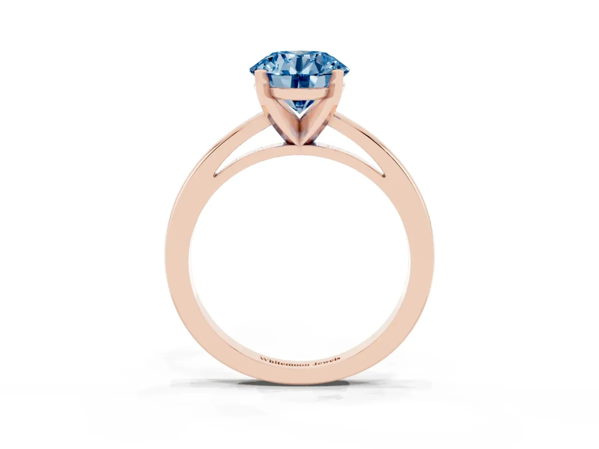 Fancy Blue Round Cut Solitaire Diamond Engagement Ring with Four-Prong Setting on a Classic Band Rose gold