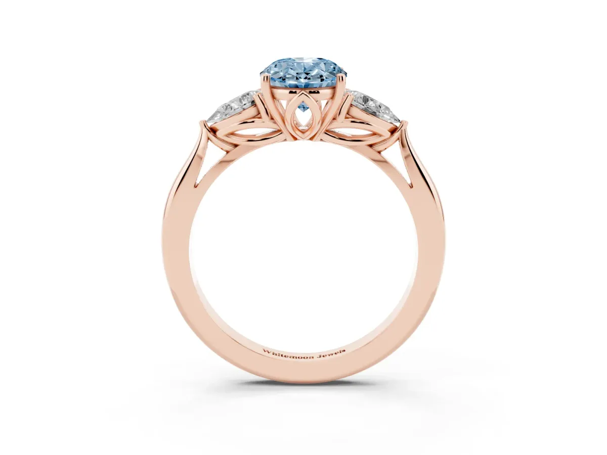 Fancy Blue Three-Stone Oval Cut Diamond Ring with Pear Side Stones in Four-Prong Setting Rose gold