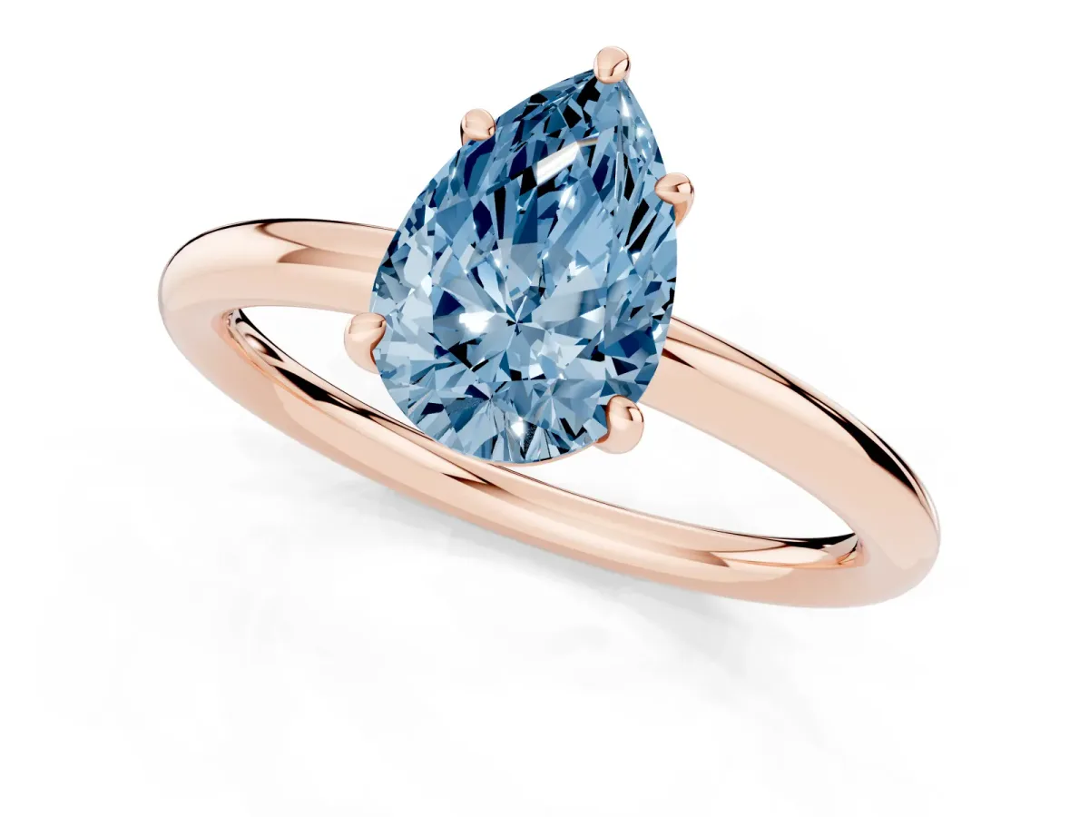 Fancy Blue Pear Cut Solitaire Diamond Ring with Four-Prong Setting on a Plain Band Rose gold