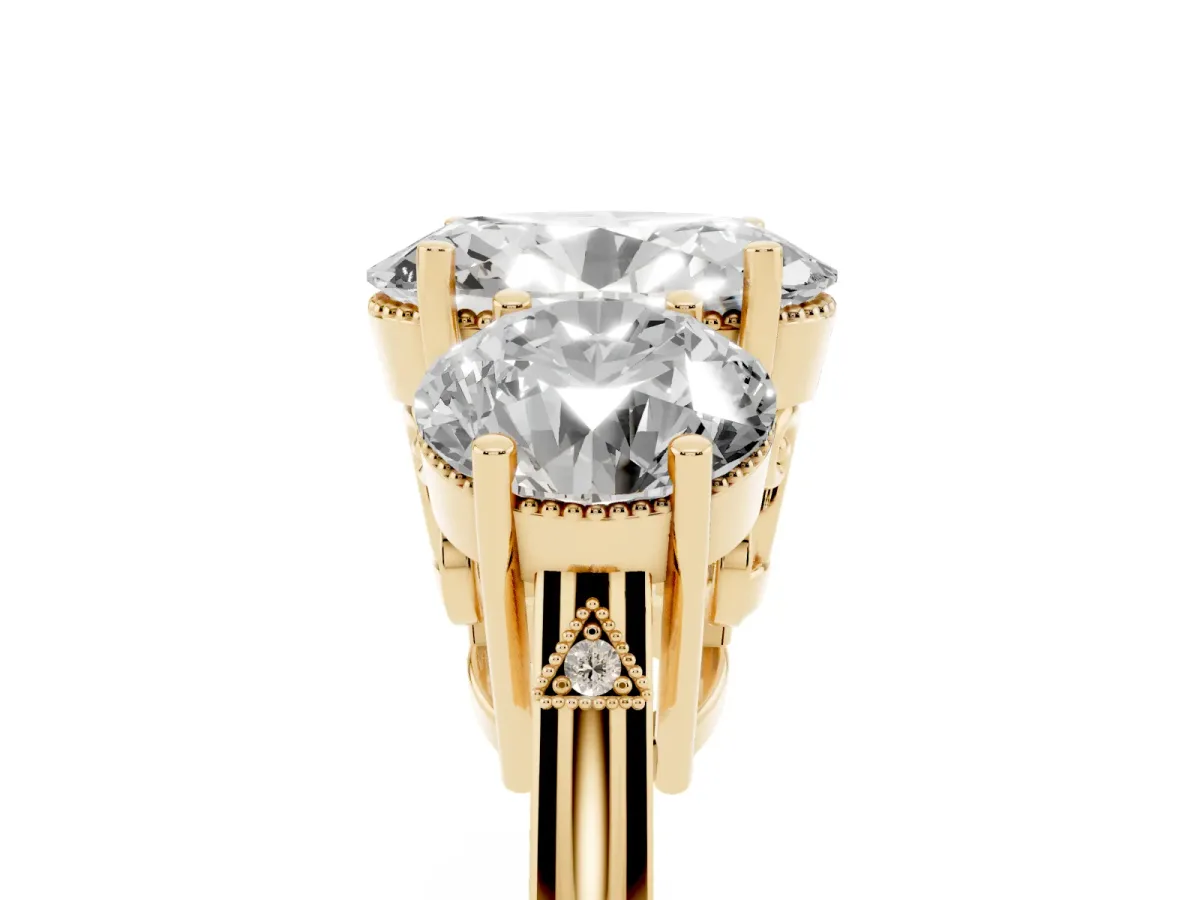 Three-Stone Oval Cut Diamond Engagement Ring with Prong Setting on a Classic Band Yellow gold