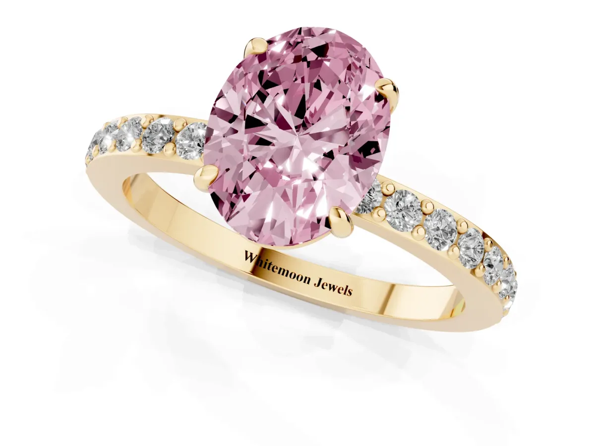 Fancy Pink Oval Cut Diamond Pavé Engagement Ring with Round Accents and Prong Setting Yellow gold