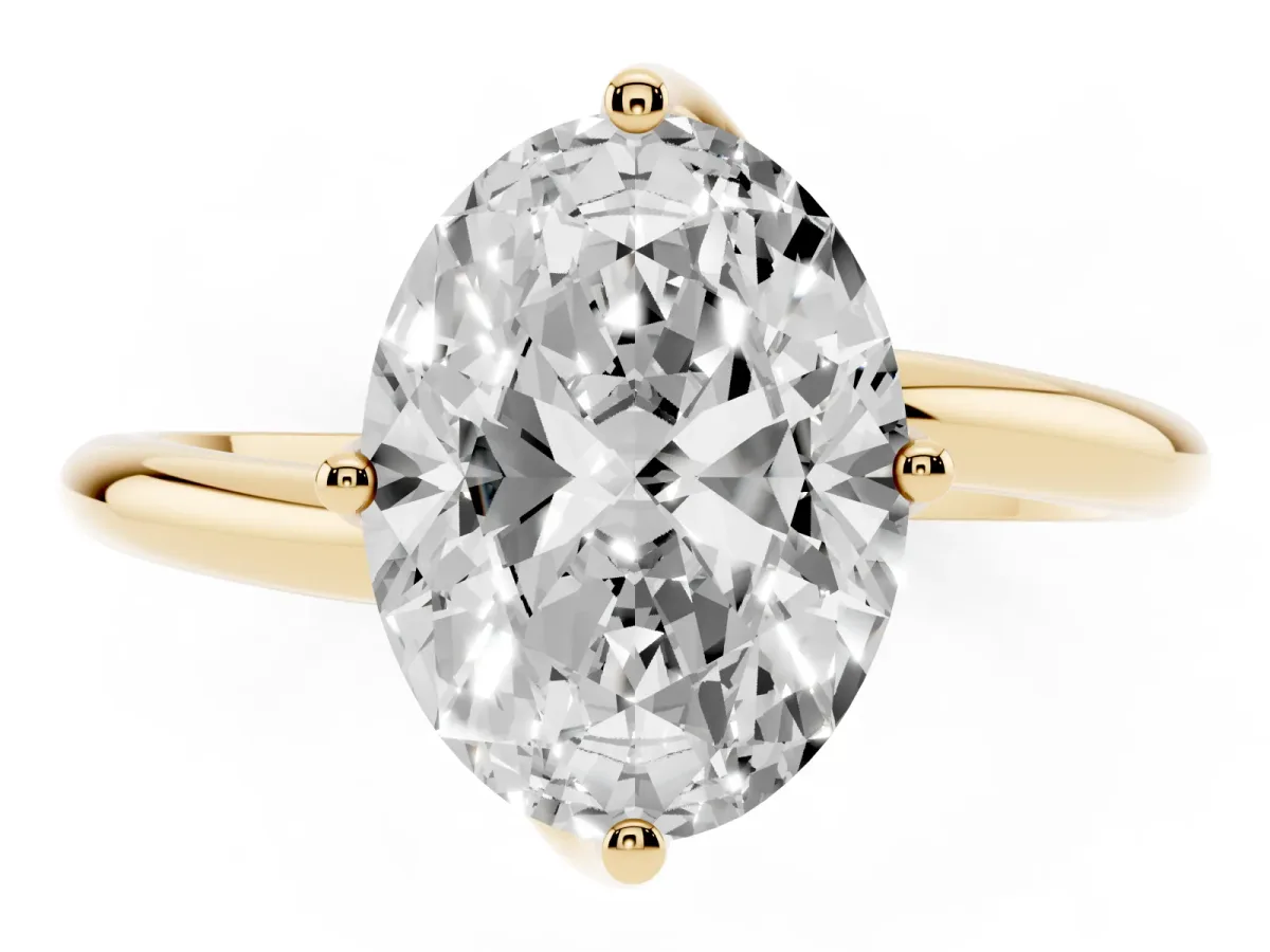 Oval Cut Diamond Solitaire Engagement Ring with Four-Prong Setting and Classic Band Yellow gold