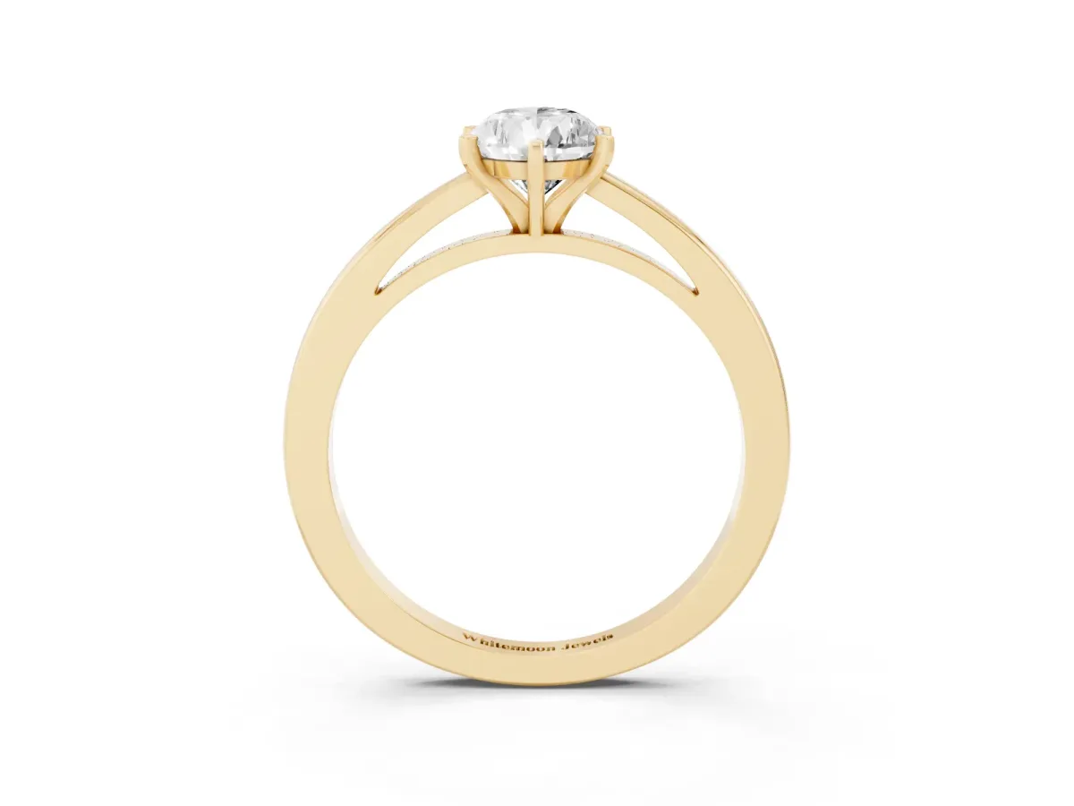 Pear Cut Solitaire Diamond Engagement Ring with Four-Prong Setting on a Classic Band Yellow gold