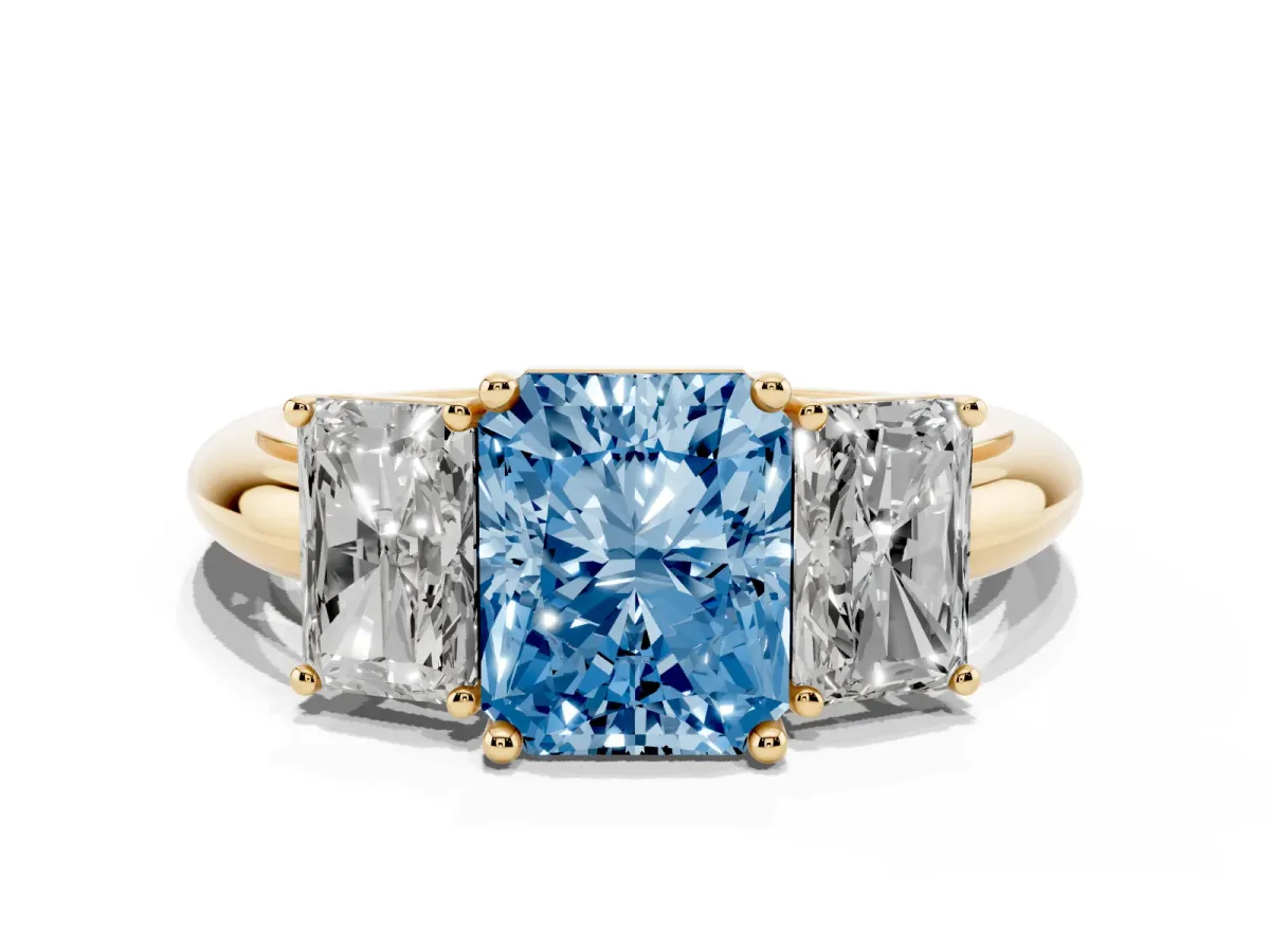 Fancy Blue Three-Stone Radiant Cut Cut Diamond Engagement Ring with Prong Setting on a White Gold Band Yellow gold