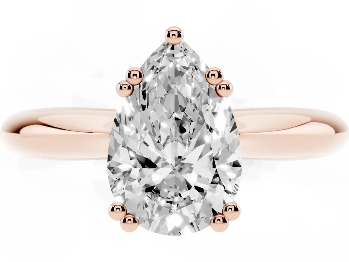 Pear Cut Cut Solitaire Engagement Ring with Tapered Band and Four-Prong Setting Rose gold