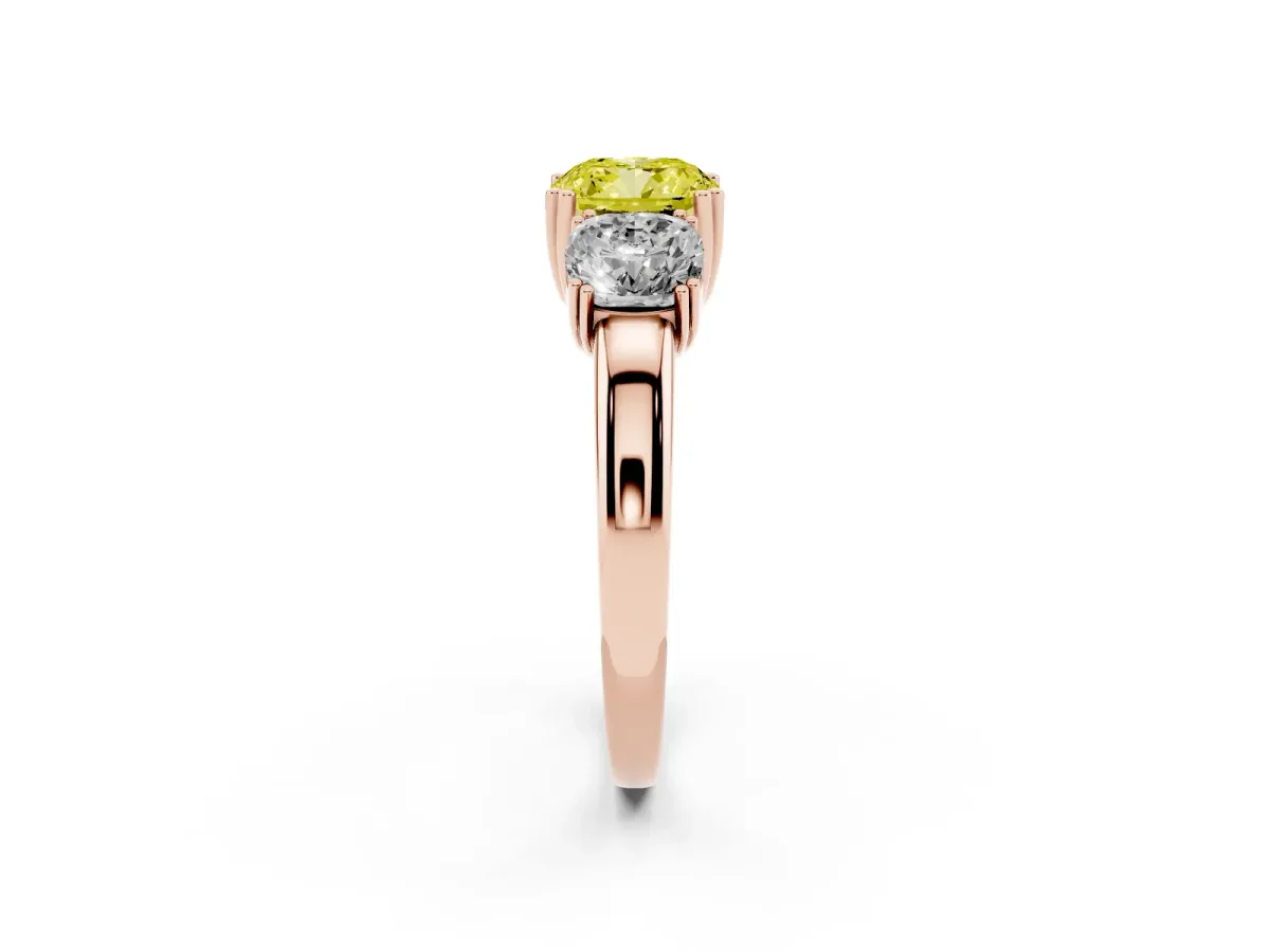 Fancy Yellow Three-Stone Cushion Cut Cut Diamond Ring with Channel Set Band and Four-Prong Setting Rose gold