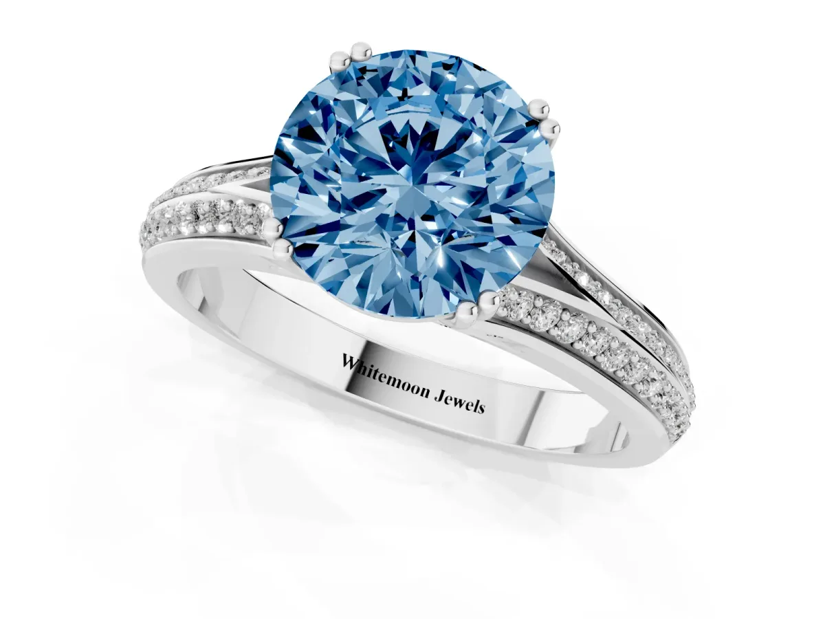 Fancy Blue Round Cut Diamond Split Shank Engagement Ring with Pavé Band Silver