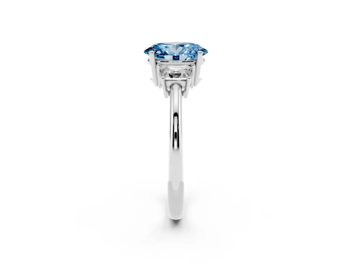 Fancy Blue Oval Cut Diamond Three-Stone Ring with Trapezoid Side Stones and Prong Setting Silver