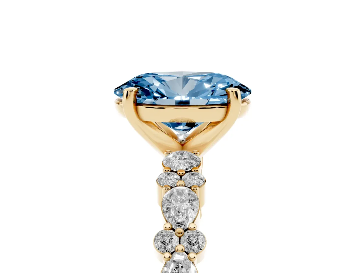 Fancy Blue Oval Cut Diamond Side Stone Solitaire Ring with Round and Four-Prong Setting Yellow gold