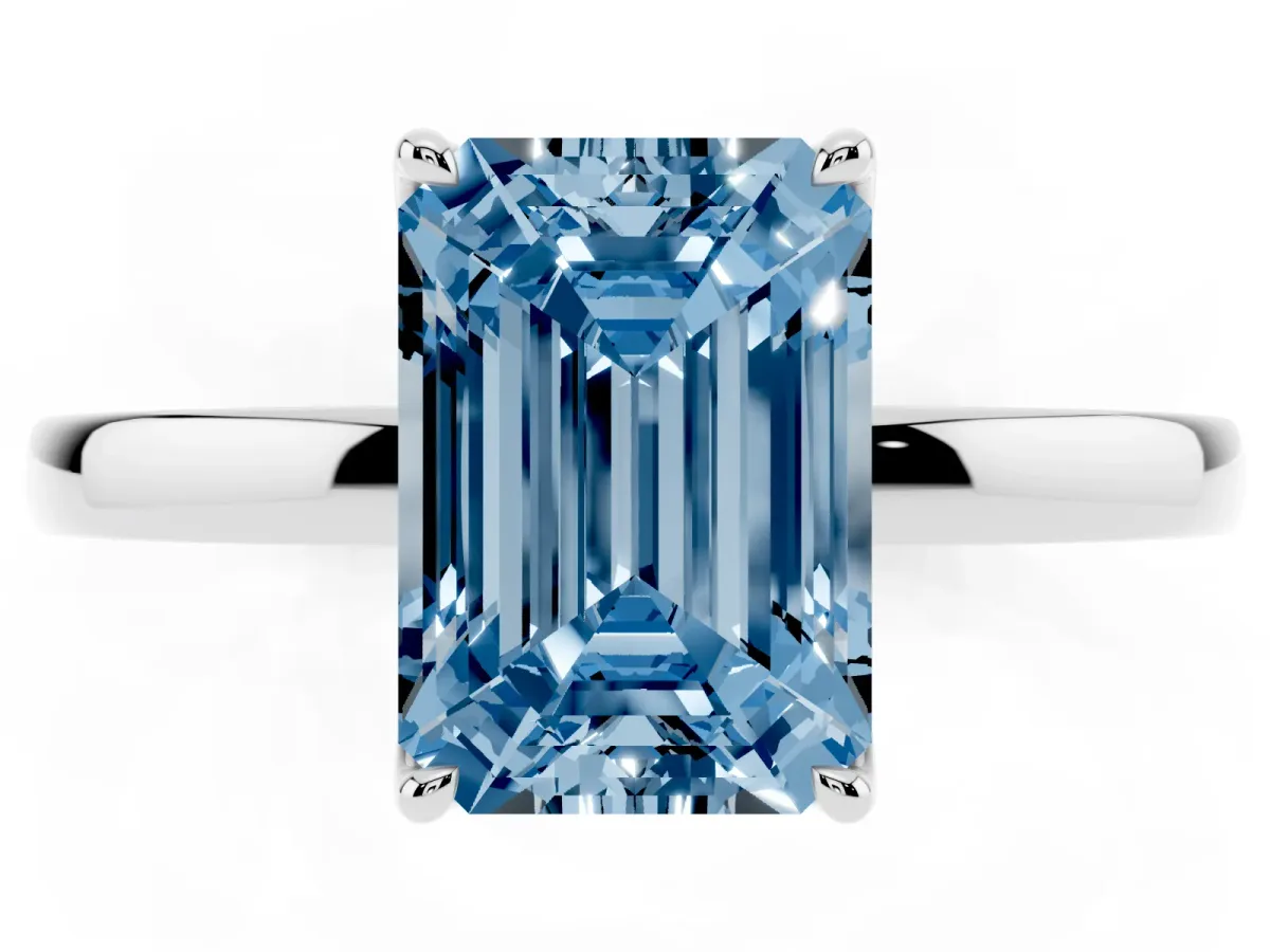 Fancy Blue Emerald Cut Diamond Solitaire Ring with Thin Band and Prong Setting Silver