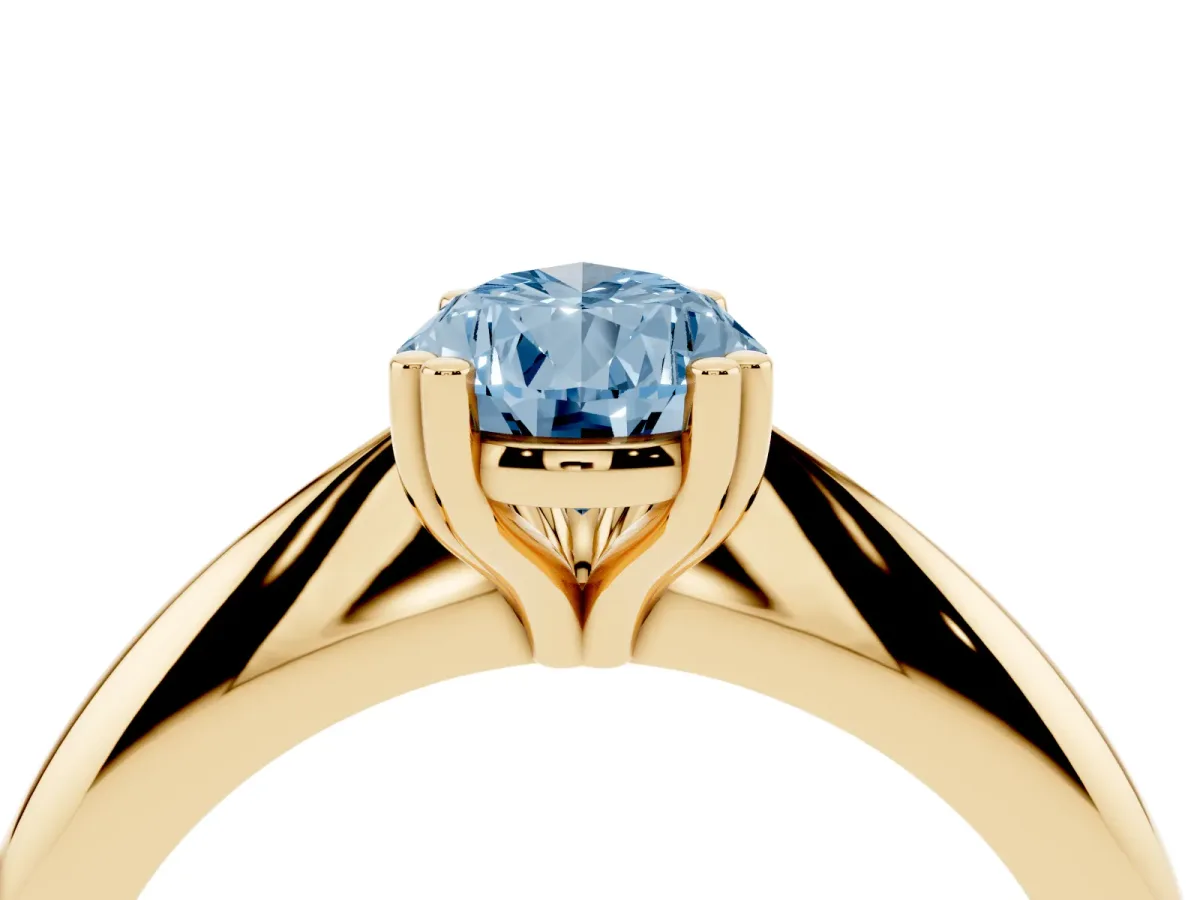 Fancy Blue Pear Cut Cut Solitaire Engagement Ring with Tapered Band and Four-Prong Setting Yellow gold