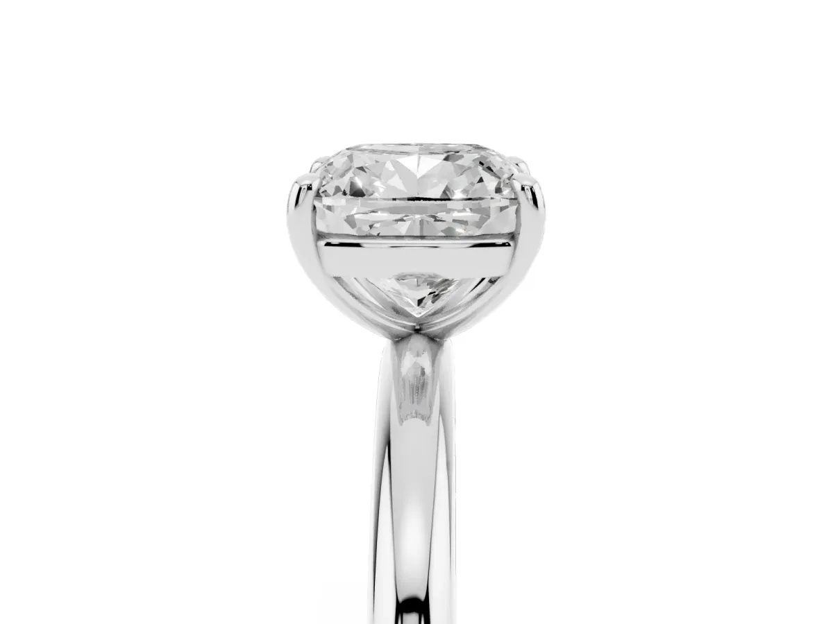 Cushion Cut Solitaire Diamond Ring with Four-Prong Setting on a Plain Band Platinum