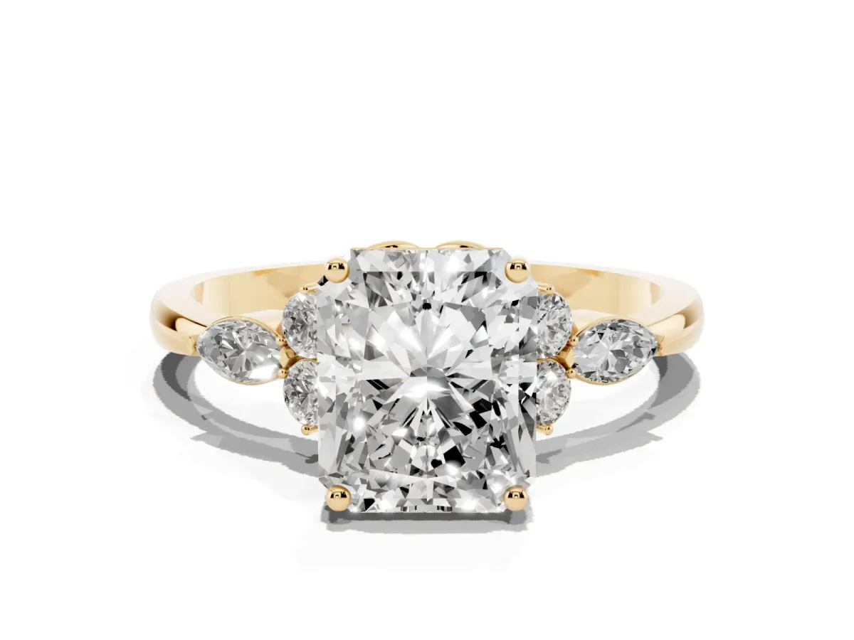 Radiant Cut Brilliant Diamond Solitaire Ring with Pear Side Stones and Four-Prong Setting Yellow gold