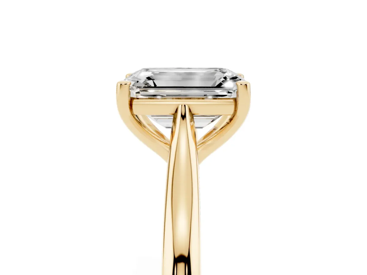 Emerald Cut Cut Solitaire Ring with Cathedral Band and Four-Prong Setting Yellow gold