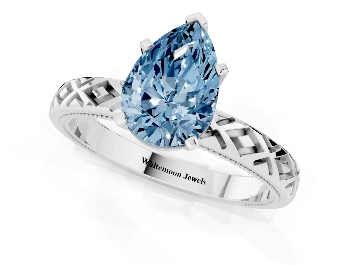 Fancy Blue Pear Cut Solitaire Diamond Ring with Milgrain and Black Enamel X Pattern Band Silver