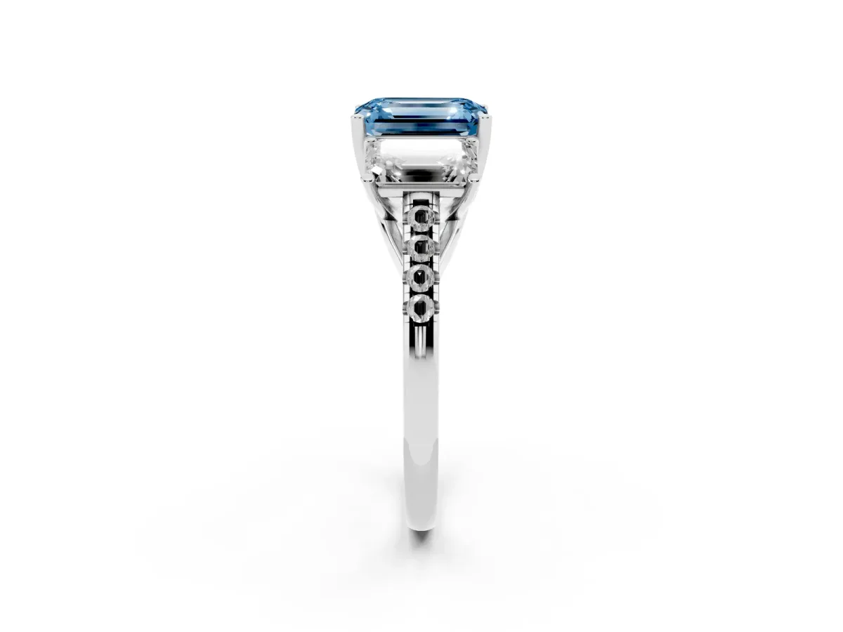 Fancy Blue Three-Stone Emerald Cut Diamond Ring with Round Pavé Band and Prong Setting Silver