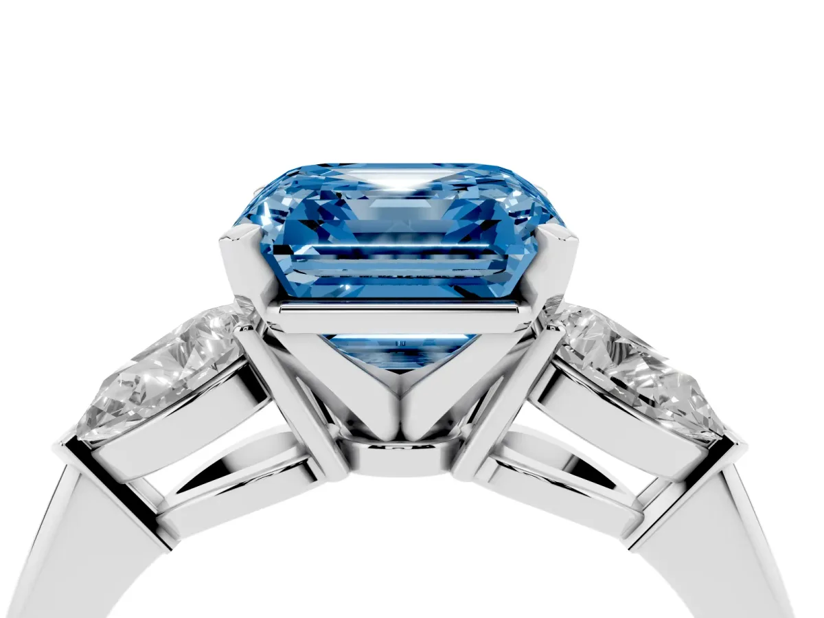 Fancy Blue Three-Stone Asscher Cut Diamond Ring with Pear Side Stones and Four-Prong Setting Platinum
