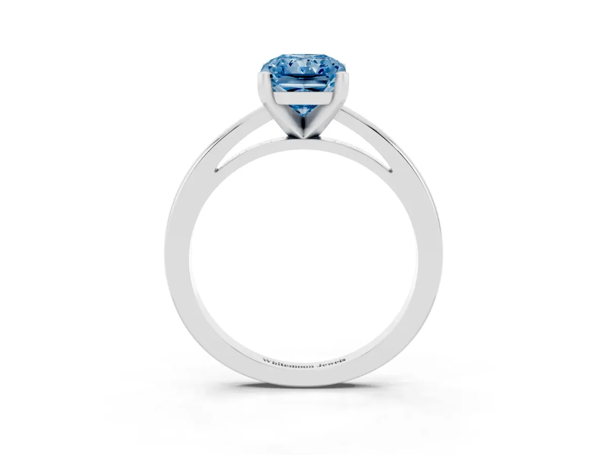 Fancy Blue Radiant Cut Solitaire Diamond Engagement Ring with Four-Prong Setting on a Classic Band Platinum